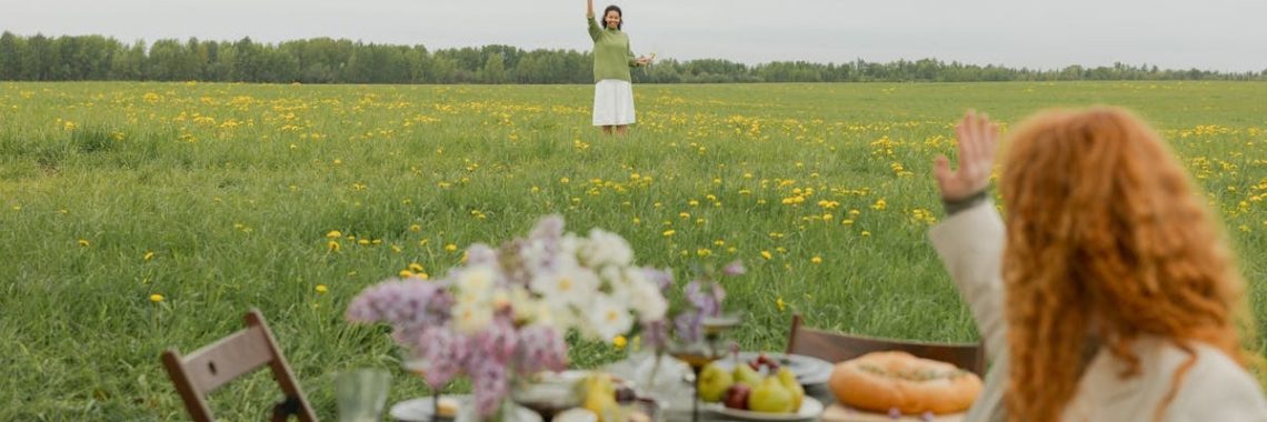 A relaxing spring picnic with friends in a vibrant dandelion field. Enjoy a peaceful outdoor dining experience.