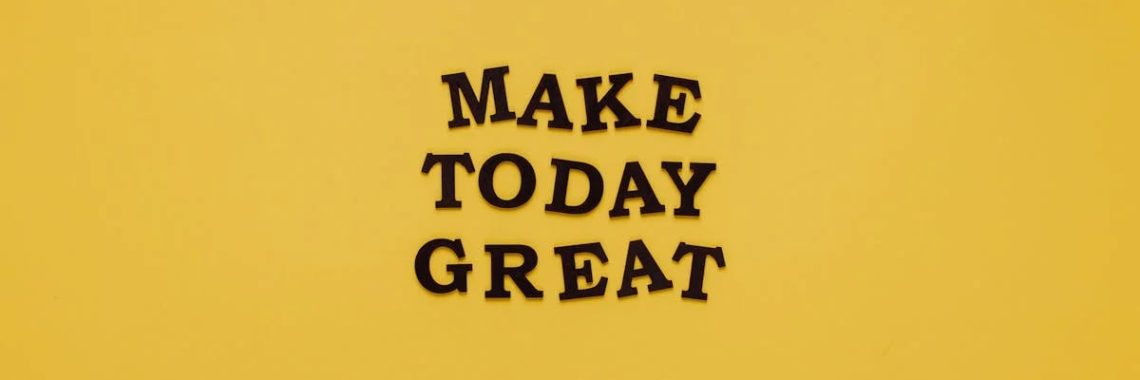 Simple and motivational quote 'Make Today Great' on a minimalist yellow background for inspiration.